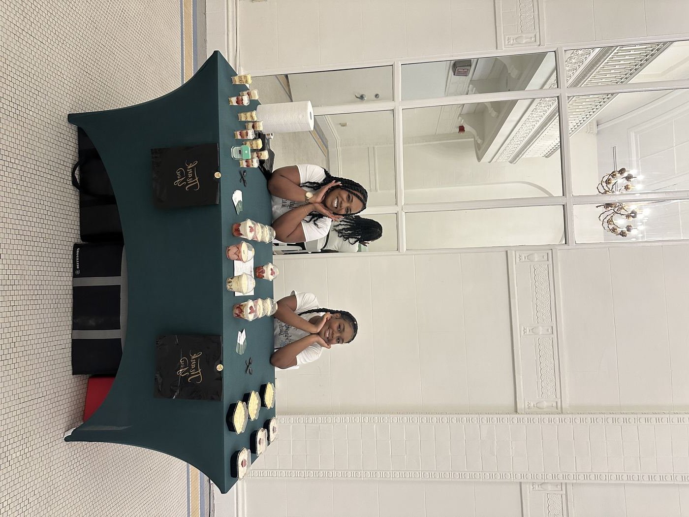Amirah and her mother at their vendor table
